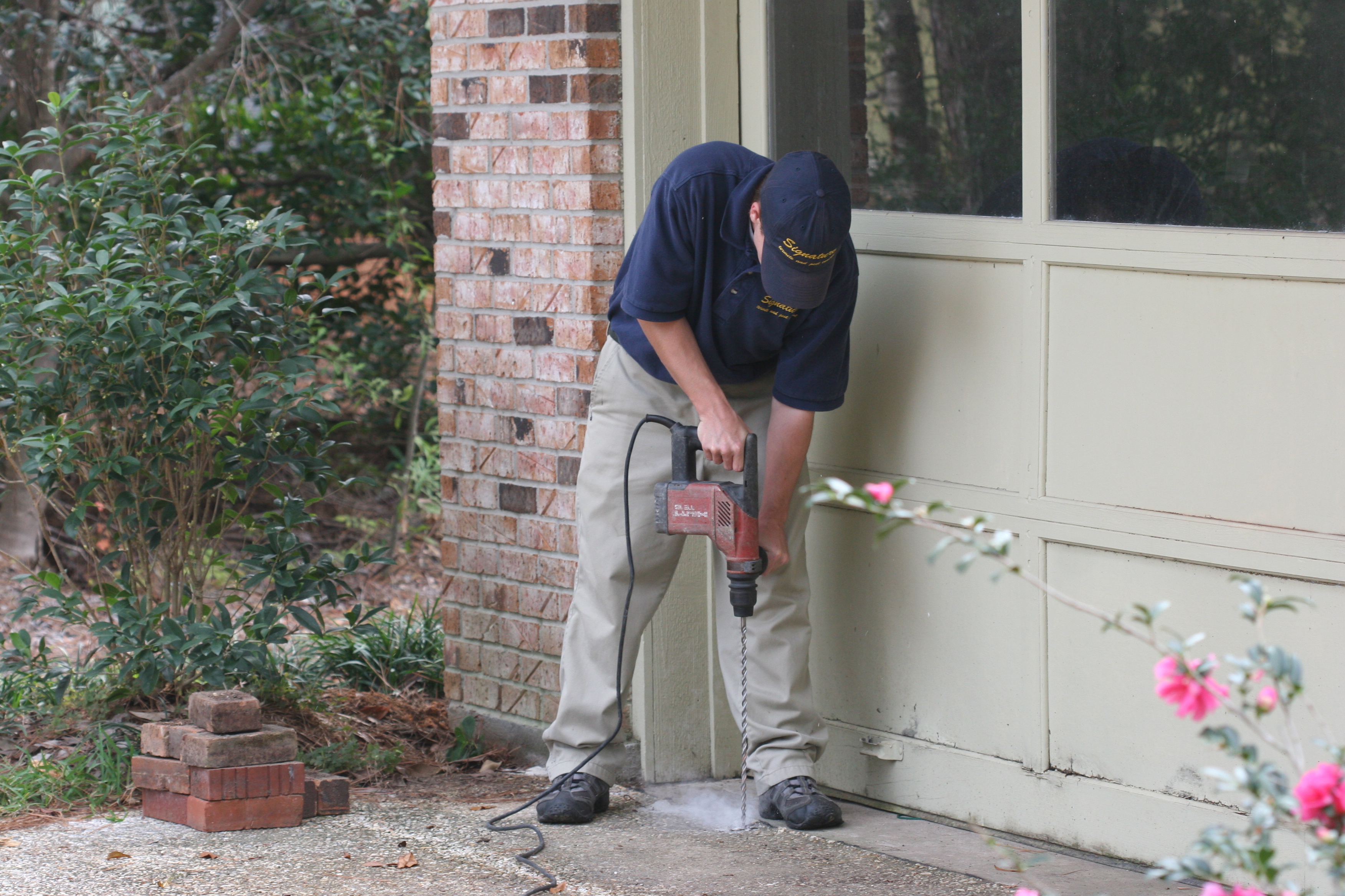 Signature Termite & Pest Control Team Member Working Signature Termite & Pest Control Team Member Working