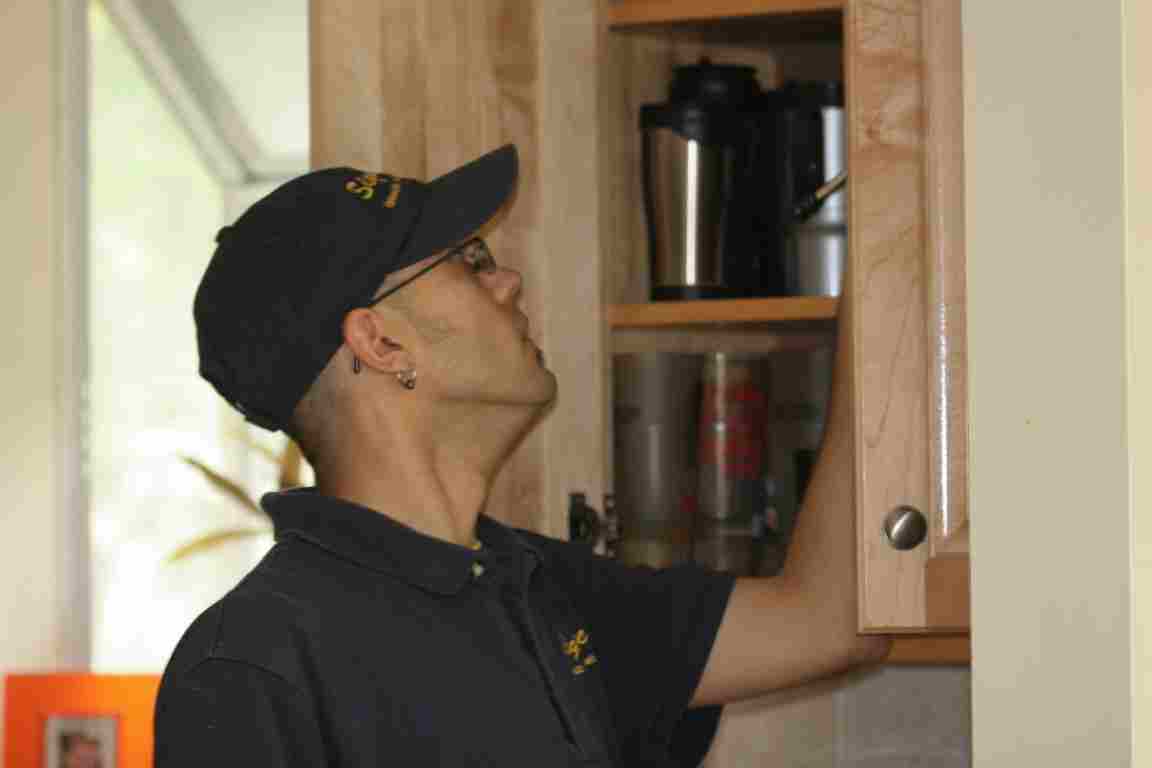 Signature Staff Working on Kitchen Cabinet Signature Staff Working on Kitchen Cabinet